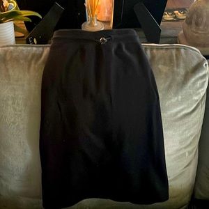 Black mini skirt with pockets.